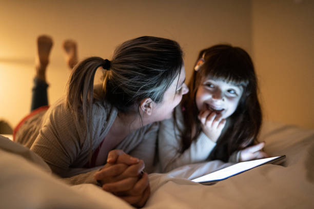 mother and daughter watching something on digital t.jpg